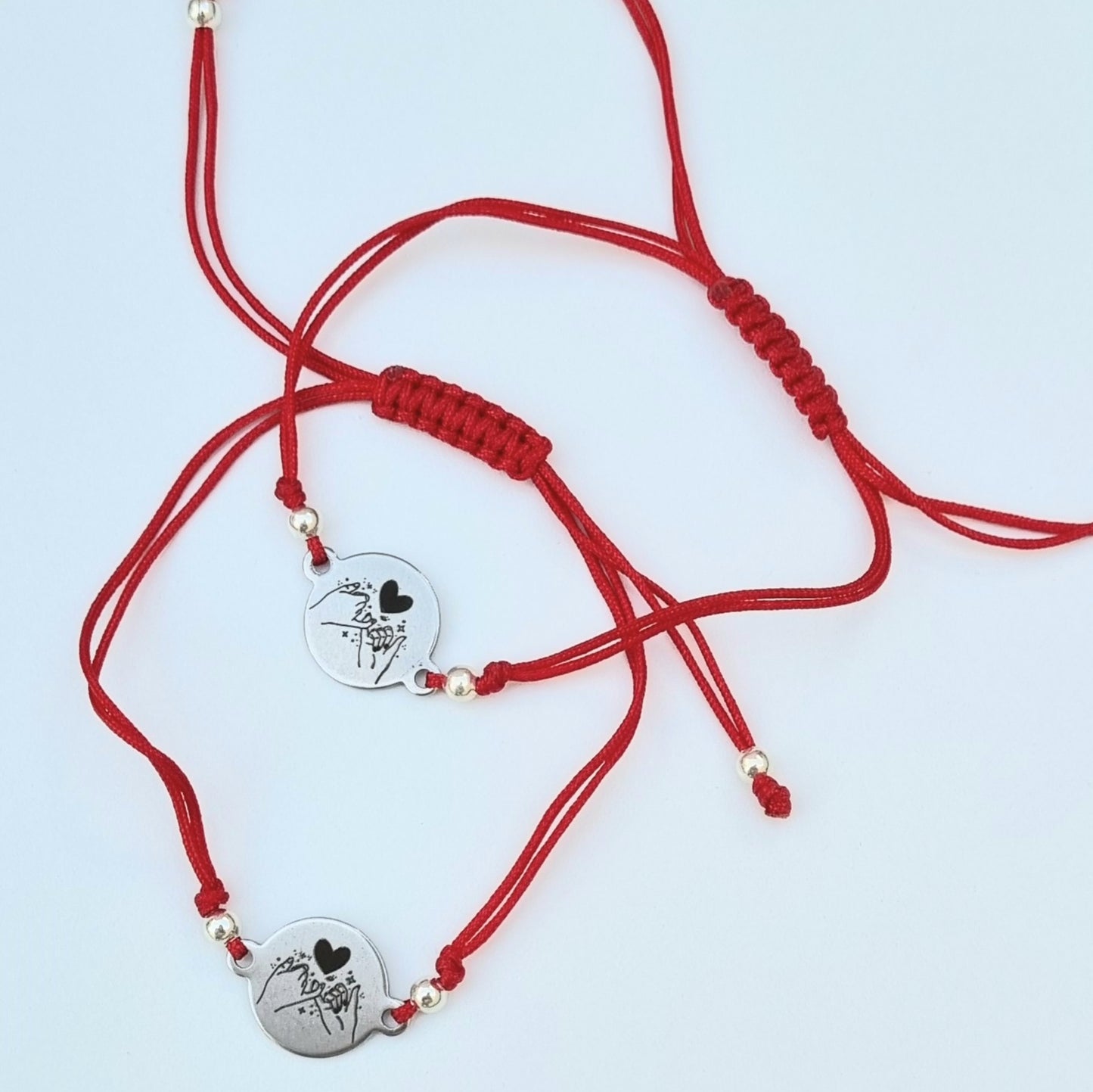 DUO DE PULSERAS AMOR Y LA AMISTAD ROJAS CON DIJE DE ACERO INOXIDABLE